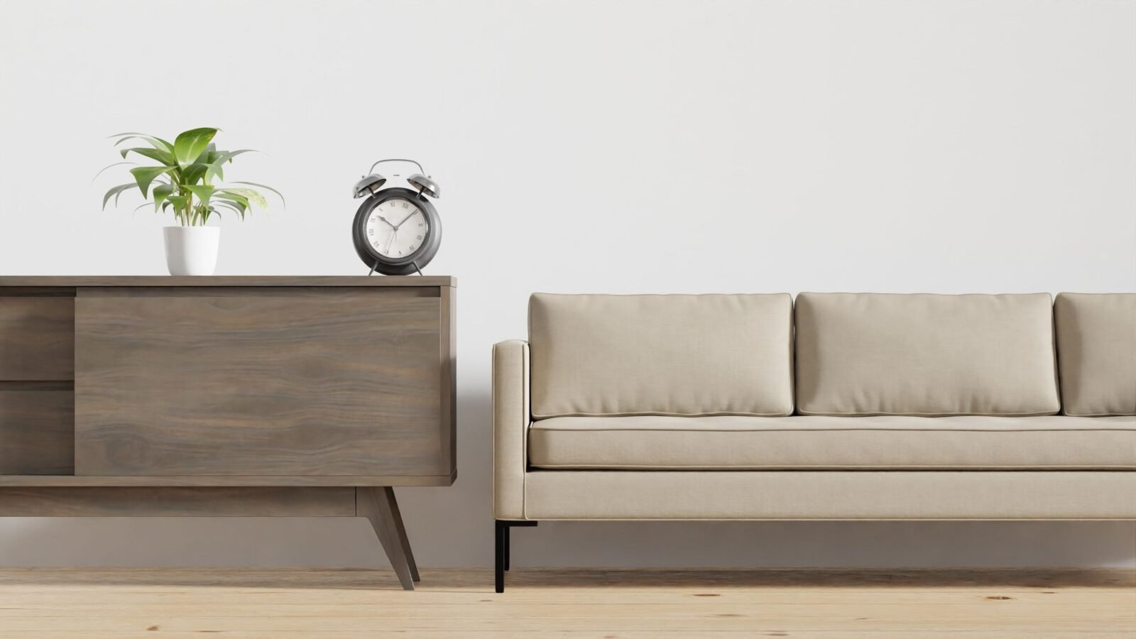 Minimal neutral living room with beige seating, wood furniture, and a potted plant.