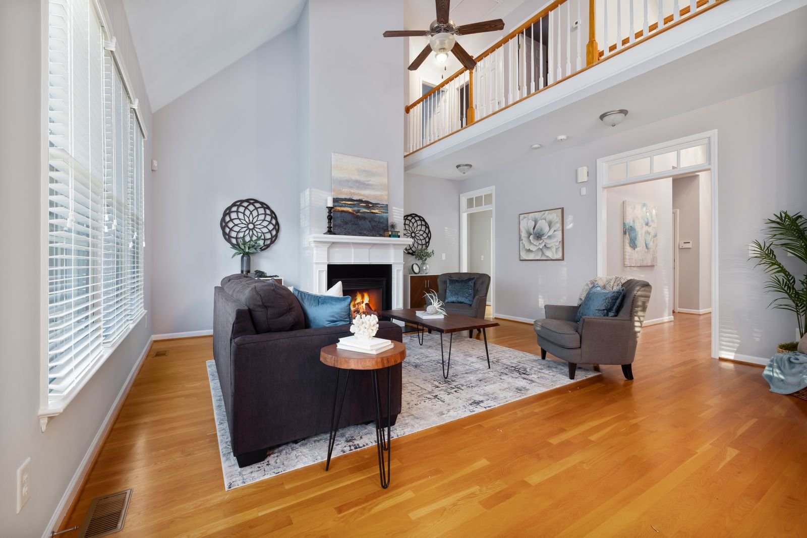 Modern neutral greige living room with a sofa, wood accents, and soft lighting
