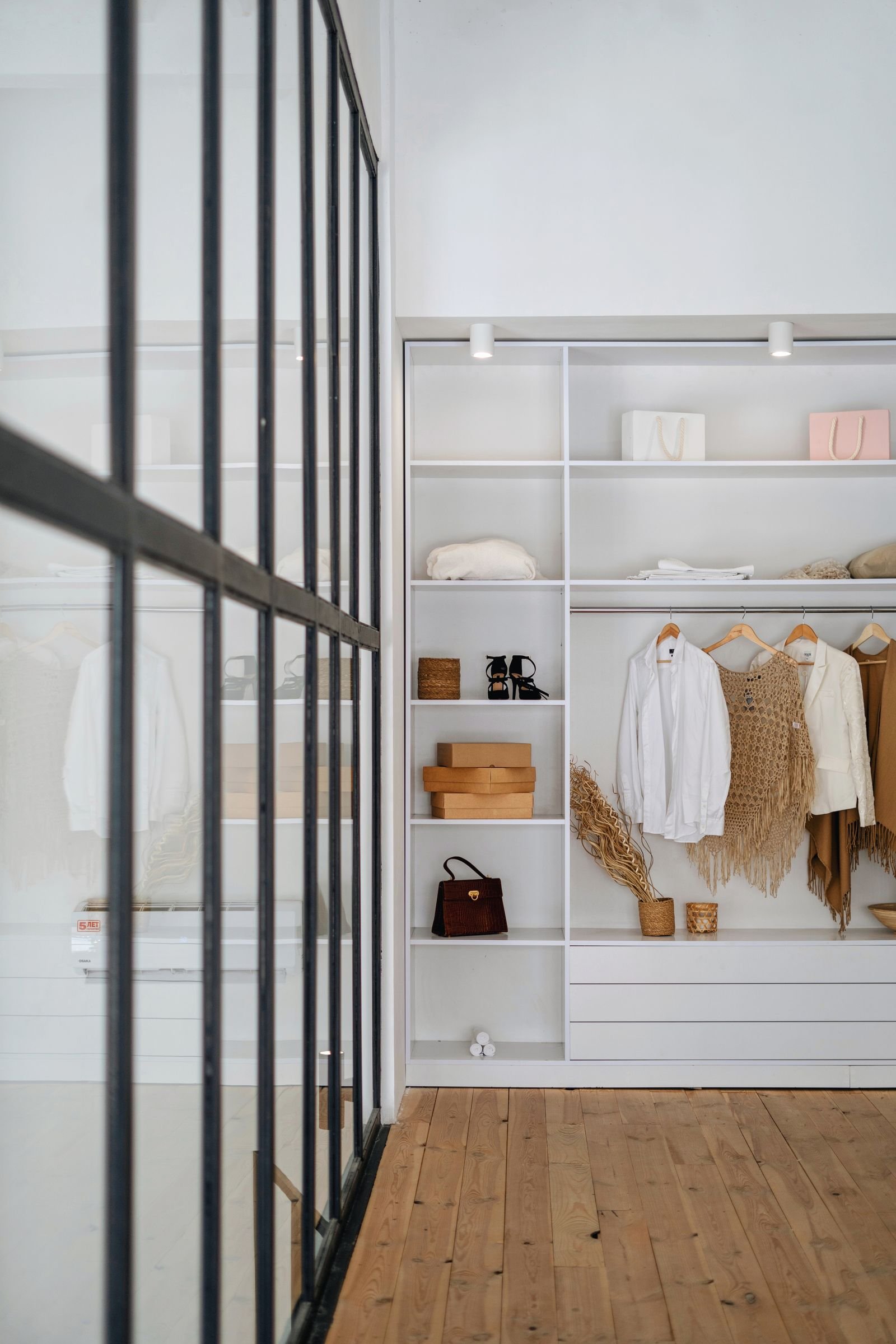 Organized minimalist wardrobe and shelves in a small apartment