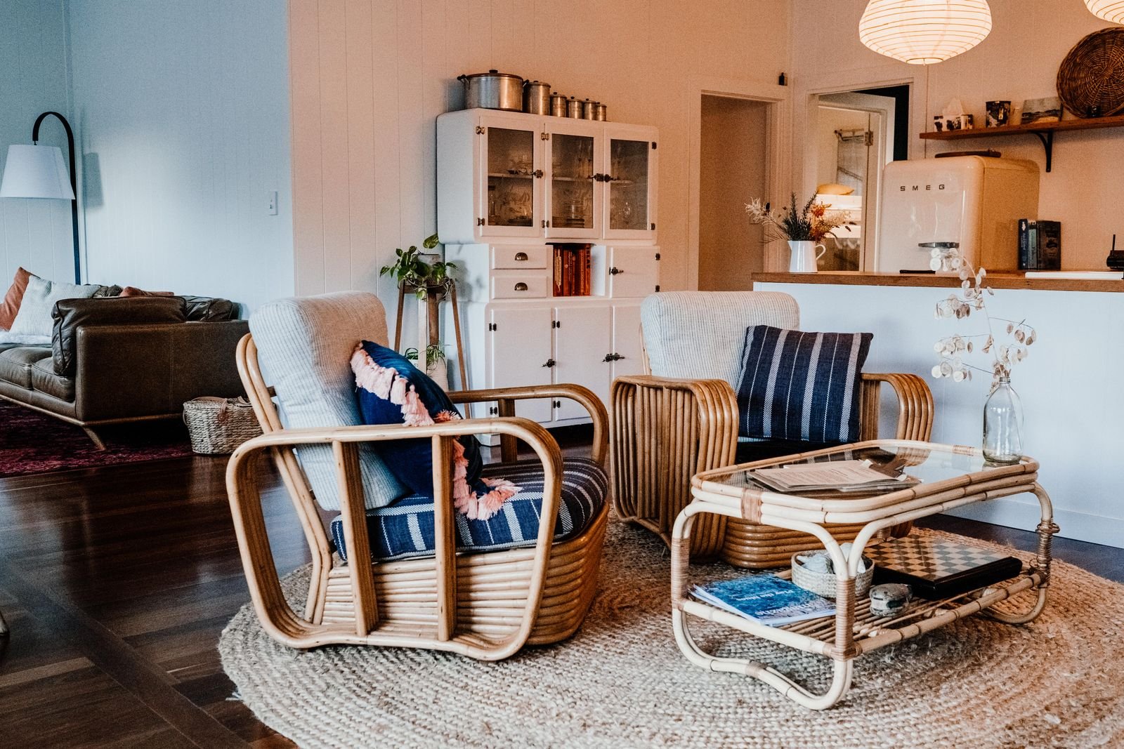 Warm earthy boho living room with terracotta tones, rattan furniture, and natural textures